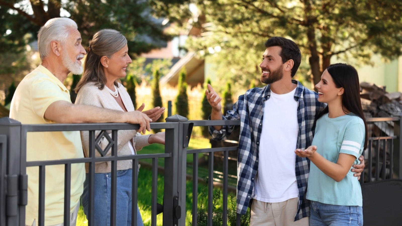 Couples talking to neighbour