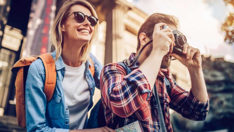 Tourist couples exploring places