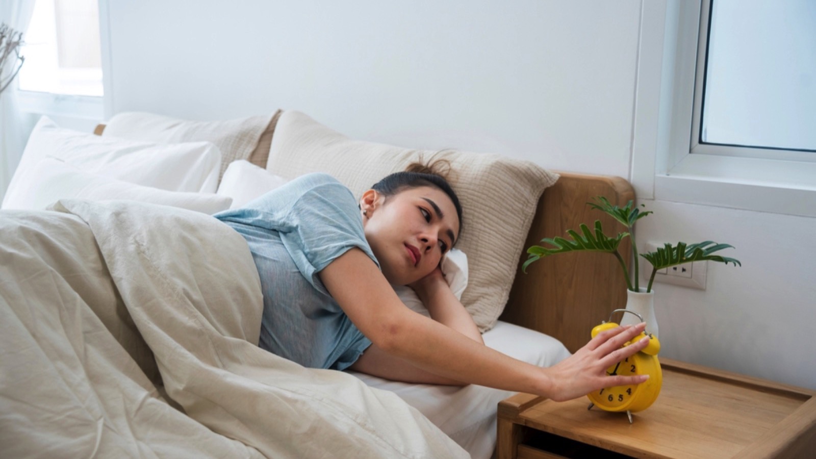 Woman switching off alarm